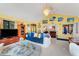 Spacious living area featuring a large TV and ample seating at 2886 Bay Shore Dr, Safety Harbor, FL 34695