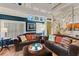 Open living space with two sofas, a coffee table, and a view into the kitchen at 2886 Bay Shore Dr, Safety Harbor, FL 34695