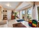 Living room with water views and sliding glass doors leading to patio at 2886 Bay Shore Dr, Safety Harbor, FL 34695
