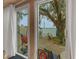 Peaceful patio with water views and lush landscaping at 2886 Bay Shore Dr, Safety Harbor, FL 34695
