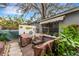 Relaxing patio with covered seating and lush greenery at 2886 Bay Shore Dr, Safety Harbor, FL 34695