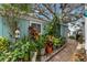 Landscaped side yard with brick path and various plants at 2886 Bay Shore Dr, Safety Harbor, FL 34695