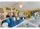 Bright sunroom with water views, plenty of seating, and access to the kitchen at 2886 Bay Shore Dr, Safety Harbor, FL 34695
