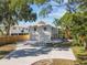 Long driveway leading to a two-car garage at 3098 Phoenix Ave, Oldsmar, FL 34677