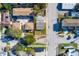 Aerial view of a single-Gathering home with a yard, located in a residential neighborhood at 312 S Arrawana Ave, Tampa, FL 33609