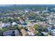 Aerial view of a residential neighborhood with houses and lush green trees at 312 S Arrawana Ave, Tampa, FL 33609