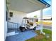 Covered carport area with golf cart at 34514 Rose N Dr, Pinellas Park, FL 33781