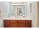 Bathroom features a vanity with drawers and a large mirror at 36900 Grace Ave, Zephyrhills, FL 33542