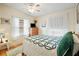 Bedroom with wood floors, a full bed, and a dresser at 36900 Grace Ave, Zephyrhills, FL 33542