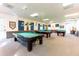 Spacious recreation room with several billiard tables at 36900 Grace Ave, Zephyrhills, FL 33542