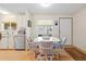 Kitchen dining area with table and four chairs at 36900 Grace Ave, Zephyrhills, FL 33542