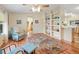 Bright living room with hardwood floors, built in shelving and comfy seating at 36900 Grace Ave, Zephyrhills, FL 33542
