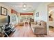 Spacious living room with hardwood floors, large windows and comfortable seating at 36900 Grace Ave, Zephyrhills, FL 33542