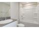 Bathroom with a shower/tub combo, toilet, vanity, and mirror at 37295 Sagemoor Dr, Zephyrhills, FL 33541