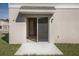 Private patio with sliding glass doors leading to the backyard at 37303 Sagemoor Dr, Zephyrhills, FL 33541