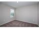 Upstairs bedroom with carpeted floor and window at 37303 Sagemoor Dr, Zephyrhills, FL 33541