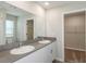 Double vanity bathroom with a large mirror and linen closet at 37306 Sagemoor Dr, Zephyrhills, FL 33541