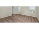 Well-lit bedroom with neutral walls and carpeting at 37306 Sagemoor Dr, Zephyrhills, FL 33541