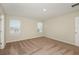 Spacious bedroom with neutral walls and carpeting, window light at 37306 Sagemoor Dr, Zephyrhills, FL 33541