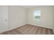 Simple bedroom with neutral walls, carpet, and a window at 37306 Sagemoor Dr, Zephyrhills, FL 33541