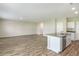 Open concept living area with wood-look floors at 37306 Sagemoor Dr, Zephyrhills, FL 33541