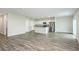 Open concept living room with kitchen and island at 37306 Sagemoor Dr, Zephyrhills, FL 33541