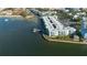 Aerial view of waterfront community with condos and private dock at 464 N Paula Dr # 220, Dunedin, FL 34698