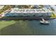 Aerial view of waterfront community, featuring a private dock at 464 N Paula Dr # 220, Dunedin, FL 34698