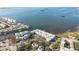 Aerial view showcasing waterfront community, pool, and dock at 464 N Paula Dr # 220, Dunedin, FL 34698
