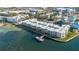 Aerial view of waterfront community with condos and a private dock at 464 N Paula Dr # 220, Dunedin, FL 34698