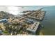 Wide aerial view of waterfront property and surrounding area at 464 N Paula Dr # 220, Dunedin, FL 34698