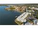 Aerial view showing building location, parking, and waterfront access at 464 N Paula Dr # 220, Dunedin, FL 34698