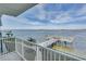 Balcony view overlooking a tranquil waterfront scene at 464 N Paula Dr # 220, Dunedin, FL 34698