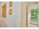 Bright entryway with access to a balcony and kitchen at 464 N Paula Dr # 220, Dunedin, FL 34698