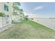 Waterfront property with grassy area and private dock access at 464 N Paula Dr # 220, Dunedin, FL 34698