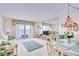 Spacious living room with water views and dining area at 464 N Paula Dr # 220, Dunedin, FL 34698