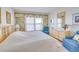 Relaxing main bedroom with water view and sitting area at 464 N Paula Dr # 220, Dunedin, FL 34698