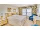 Spacious main bedroom with water views and ample dresser space at 464 N Paula Dr # 220, Dunedin, FL 34698