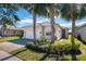 Charming house with a two-car garage and palm trees at 4846 Sandy Glen Way, Wimauma, FL 33598