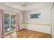 Bedroom with sliding glass door to patio access at 5011 Chancellor Ne St, St Petersburg, FL 33703