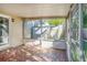 Bright screened porch with tiled floor and sliding glass doors at 5011 Chancellor Ne St, St Petersburg, FL 33703