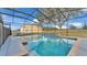 Large, screened pool with a water feature at 5704 W Farkas Rd, Plant City, FL 33567