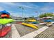 Organized kayak storage area with various kayaks at 6025 Shore S Blvd # 311, Gulfport, FL 33707