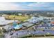 Aerial view of community with pool, tennis courts, and parking at 6303 Green Oak Cir, Bradenton, FL 34203
