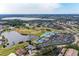 Aerial view of community with golf course and lake at 6303 Green Oak Cir, Bradenton, FL 34203