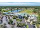 Resort-style clubhouse with pool, tennis courts, and parking at 6303 Green Oak Cir, Bradenton, FL 34203