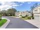Townhome community with paved roads and lush green landscaping at 6303 Green Oak Cir, Bradenton, FL 34203