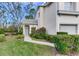 Front walkway to townhome entrance with landscaping and lighting at 6303 Green Oak Cir, Bradenton, FL 34203