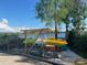 Kayaks are stored under a wooden shelter near a dock overlooking a calm lake at 6303 Green Oak Cir, Bradenton, FL 34203