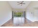 Living room with view of pond and sliding doors at 6303 Green Oak Cir, Bradenton, FL 34203